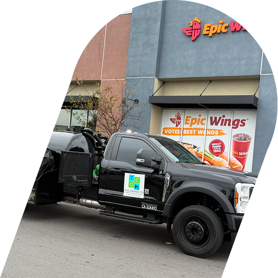 Grease trap cleaning truck stading in front of a restaurant in Garden Grove