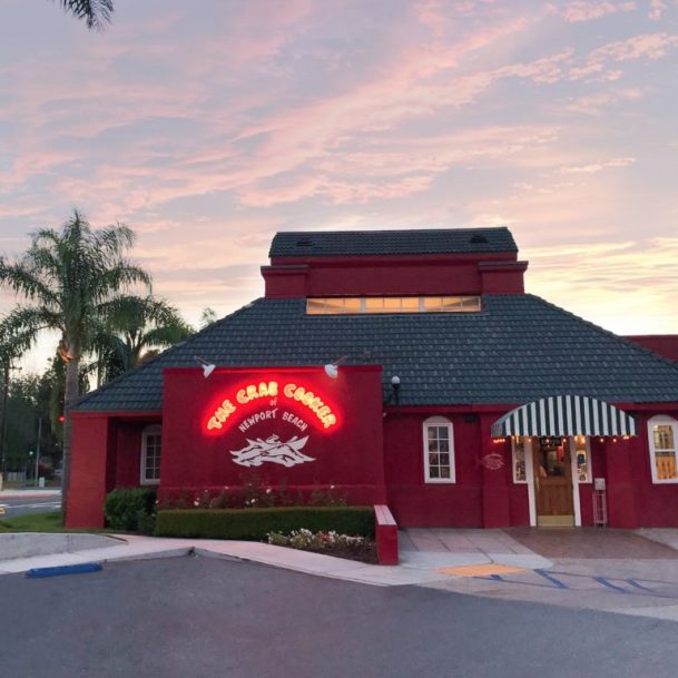 Exterior of a busy Orange County restaurant, highlighting the importance of grease trap cleaning in commercial kitchens.